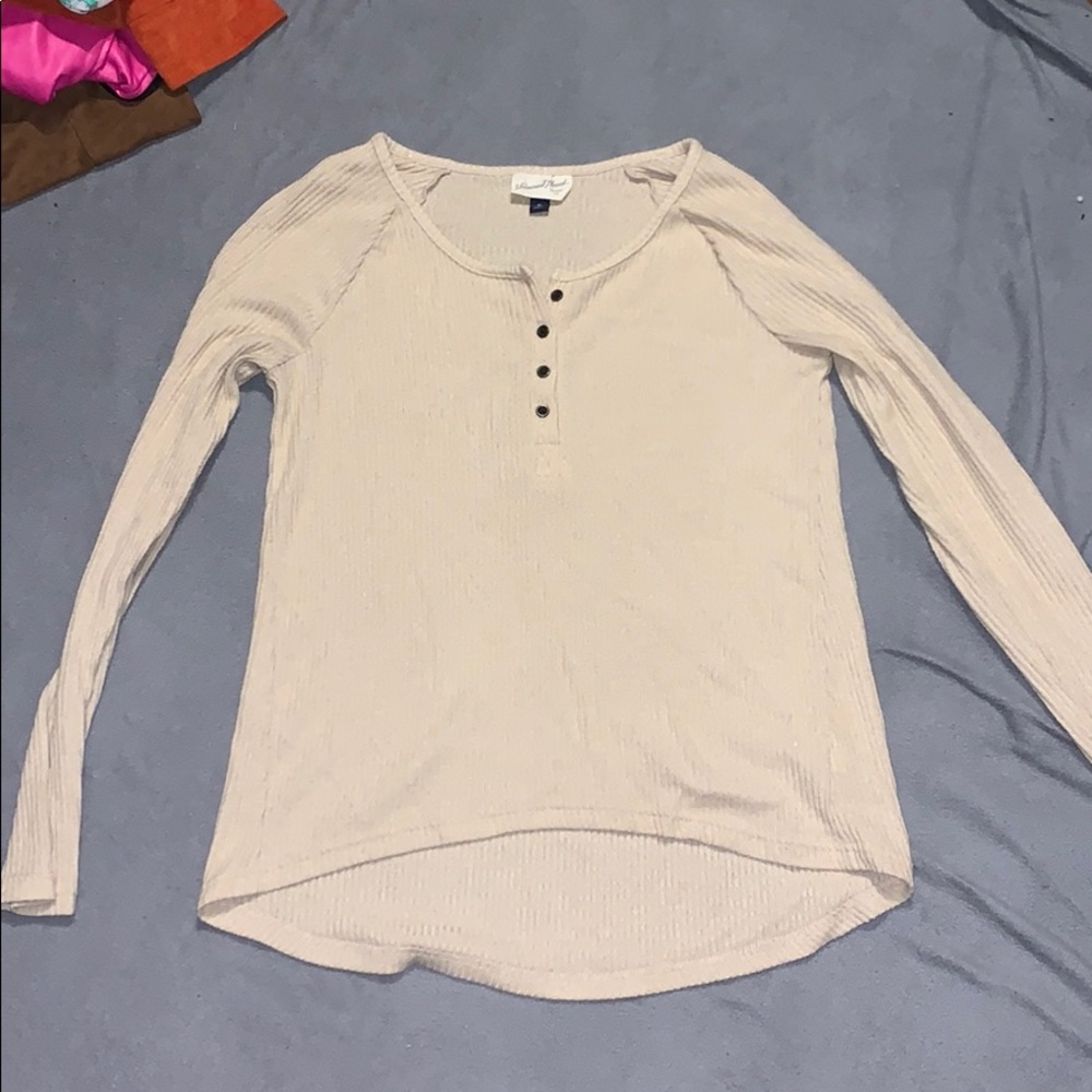 Cream colored long sleeve shirt